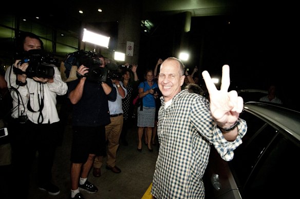 Peter Greste greets his supporters and the media after landing back in Australia at Brisbane Airport.