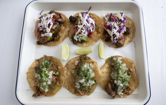 Chicken adobo tacos (top) and signature pork carnitas tacos (bottom). 