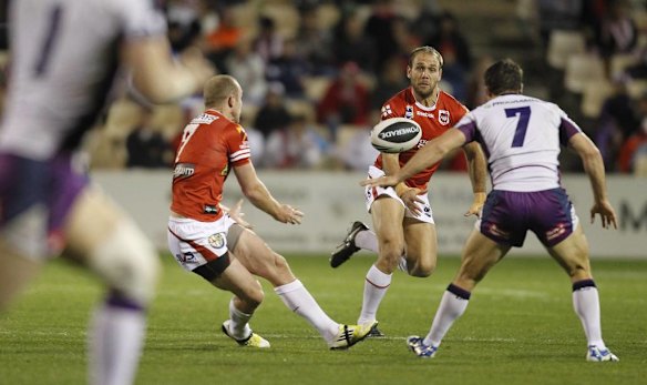 Dragons captain Ben Hornby offloads to Jason Nightingale.
