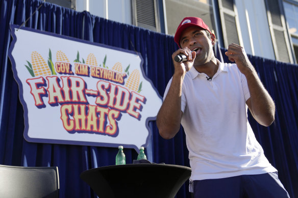 Republican presidential candidate Vivek Ramaswamy sings at the end of a Fair-Side Chat with Iowa Governor Kim Reynolds.