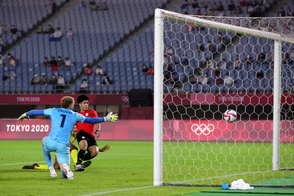 Ammar Hamdy of Team Egypt scores their side’s second goal past Thomas Glover of the Olyroos.