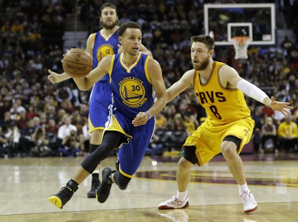 Matthew Dellavedova's game-three starring role: Steph Curry looks to get to the basket but Dellavedova tries to stop him.