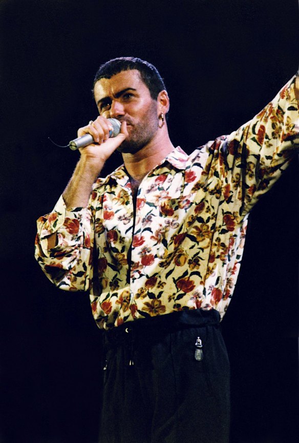 George Michael performs on stage in 1991.