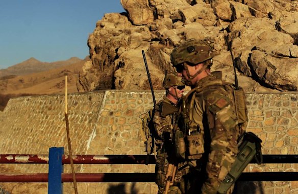 Australian soldiers patrol and search the Puza Bridge for IED's after an insurgent was arrested the night before with explosive matieral at this location. Dai Roshan Area in Uruzgan Province, Afghanistan.