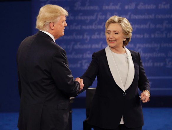 Republican presidential nominee Donald Trump and Democratic presidential nominee Hillary Clinton shake following the second presidential debate.