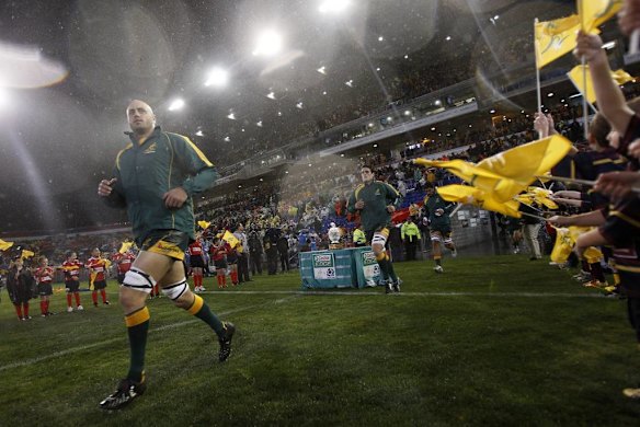 Wallaby forward Nathan Sharpe runs out onto the field.