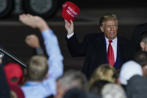 US President Donald Trump at a campaign rally in Mosinee, Wisconsin. Hackers stole $US2.3 million from the state Republican Party's account that was being used to help re-elect him. 