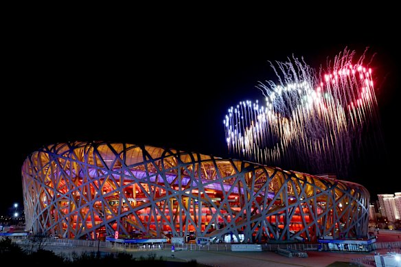 A fireworks display depicting the 5 Olympic rings is seen above the stadium during the opening ceremony of the 2022 Beijing Winter Olympiad.