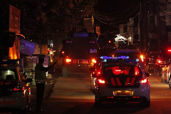 Indonesian wolf police vehicle carrying Bali Nine duo Myuran Sukumaran and Andrew Chan leaves Kerobokan Prison.