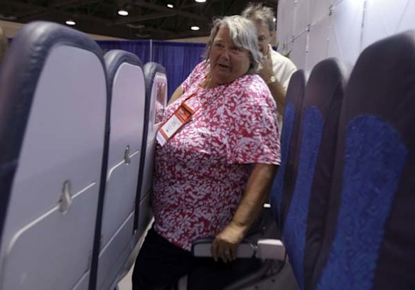 Marion Dinicola from New York tries out Italian company Aviointeriors' new aircraft 'Skyrider' seat.
