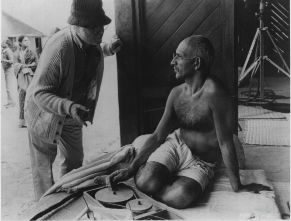 Richard Attenborough confers with Ben Kingsley who plays the Mahatma in the film.
