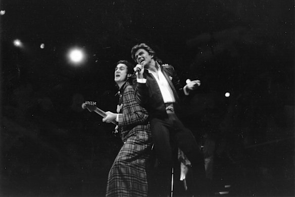George Michael and Andrew Ridgeley of pop group Wham! during a live performance. Original 