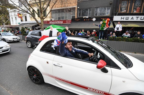 Italian soccer fans celebrate in Lygon Street, Carlton, after Italy won the Euro 2020 final against England at Wembley Stadium in London. 