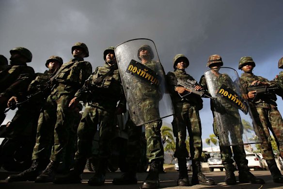 Thai soldiers stand guard during the coup at the Army Club.