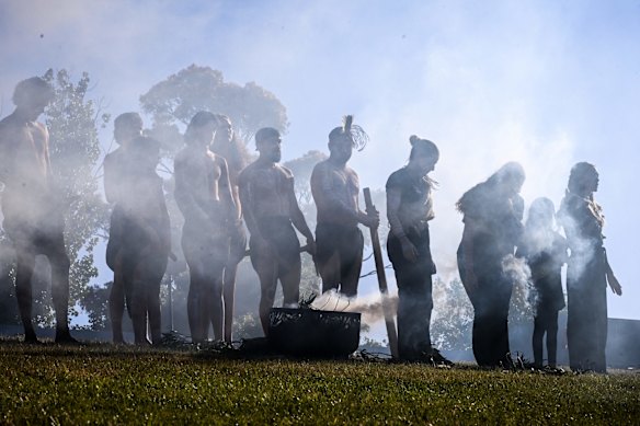 Mourners pay their respects.