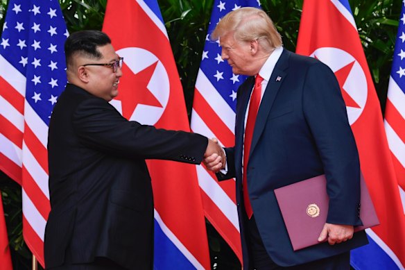 North Korea leader Kim Jong Un and U.S. President Donald Trump shake hands at the conclusion of their meetings at the Capella resort.