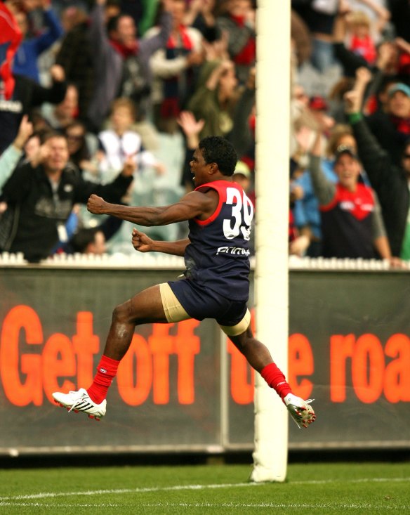 Austin Wonaeamirri enjoys a final quarter goal against the Dockers.