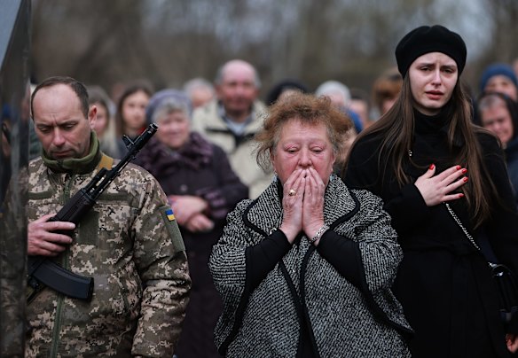Maria Korechko (centre) mourns at the burial of her son, Ukrainian soldier Andriy Zagornyakon, in Kamianka-Buzka. Zagornyakon died fighting the Russian military near the town of Popasny.