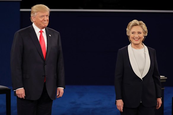 Republican presidential nominee Donald Trump stands next to Democratic presidential nominee Hillary Clinton during the second presidential debate.