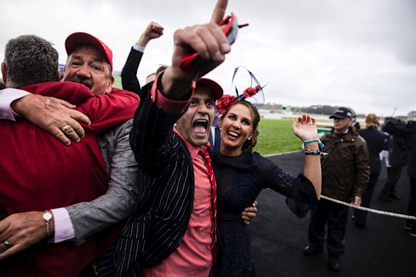 Punters celebrate Redzel winning the TAB Everest horse race held at Royal Randwick Racecourse.