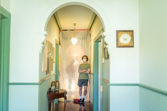 Matthew Thomas is in self isolation after returning from Los Angeles last week. He lives at one end of his parents house, separated from the rest of his family by two plastic sheet dividers.