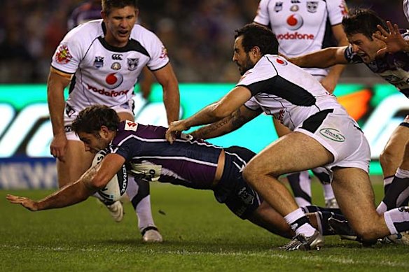 The Storm's Cameron Smith dives over the line.