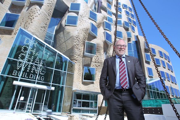 Professor Roy Green in front of the UTS business school's Dr Chau Chak Wing building opening.