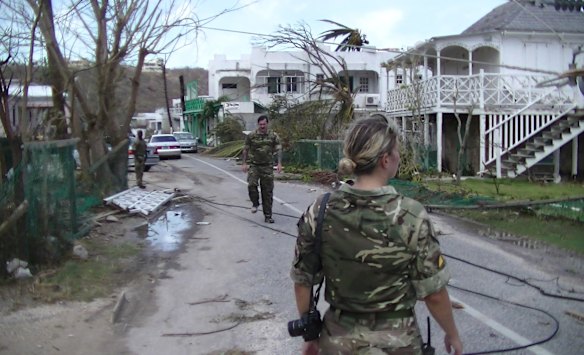 Members of the British Army's Royal Logistics Corps regiment conduct a reconnaissance of the exit from the beach ahead of landing personnel, stores and vehicles, in Anguilla. 