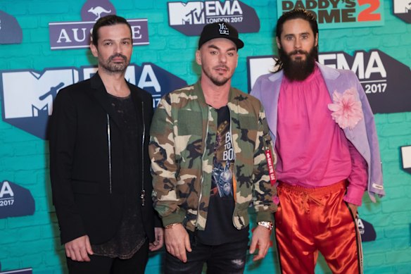 Jared Leto was one of the only artists that brought colour to the carpet in Gucci. Here he is with fellow Thirty Seconds to Mars bandmates. 