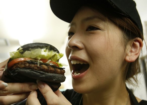 Black is the new burger: The buns are made from bamboo charcoal powder mixed in to give them a charred look, beef patties are mixed with black pepper to darken it and a black tar-like sauce is actually barbecue sauce with squid ink.