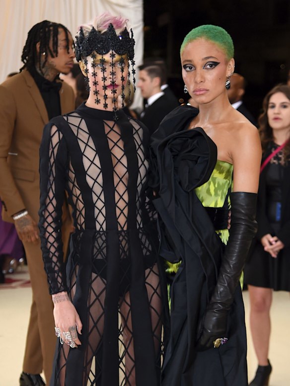 Cara Delevingne, left, and Adwoa Aboah attend The Metropolitan Museum of Art's Costume Institute benefit gala celebrating the opening of the Heavenly Bodies: Fashion and the Catholic Imagination exhibition on Monday, May 7, 2018, in New York. 