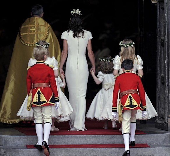 Maid of honour Pippa Middleton arrives with page boys and ring bearers.