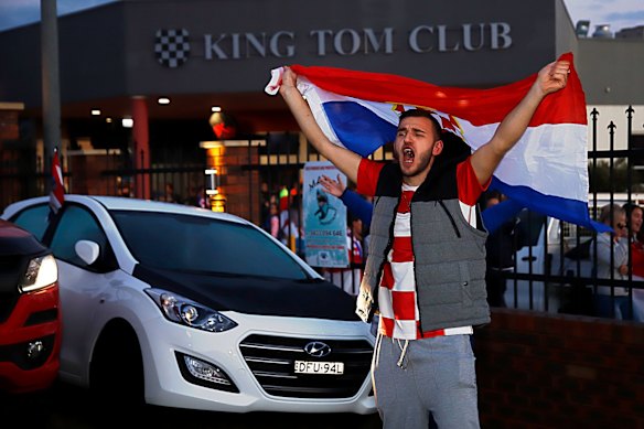Fans celebrate after the FIFA World Cup semi-final between Croatia and England at King Tom Club in Sydney.