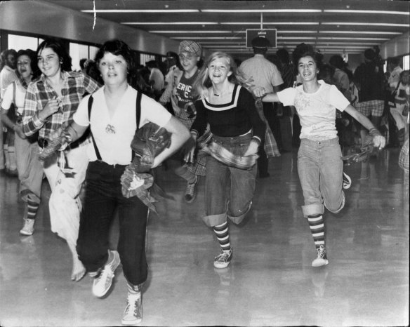 More than 200 screaming girls stampeded at Sydney Airport when the Bay City Rollers arrived in 1975