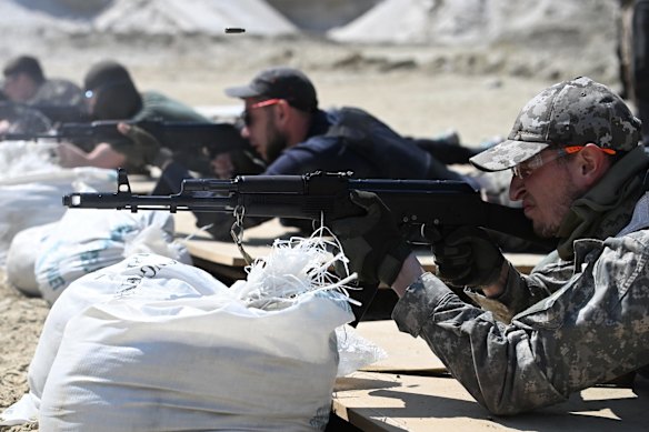 Volunteers undergo weapons training at a Territorial Defence Force facility outside Lviv in western Ukraine. The group has provided hundreds of volunteers with medical, tactical and weapons training.