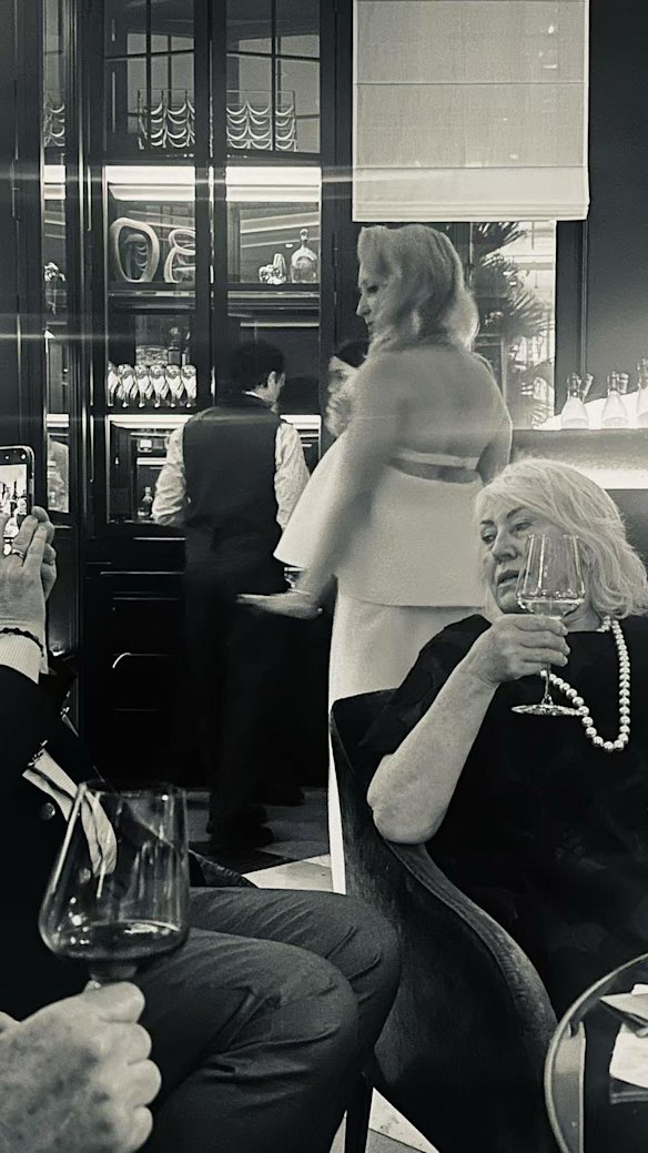 Judith Neilson (with wine glass) and Annalouise Spence behind her at Spences’s 50th birthday party.