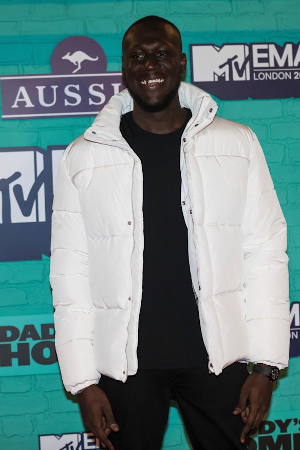 Stormzy poses for photographers upon arrival at the MTV European Music Awards 2017.