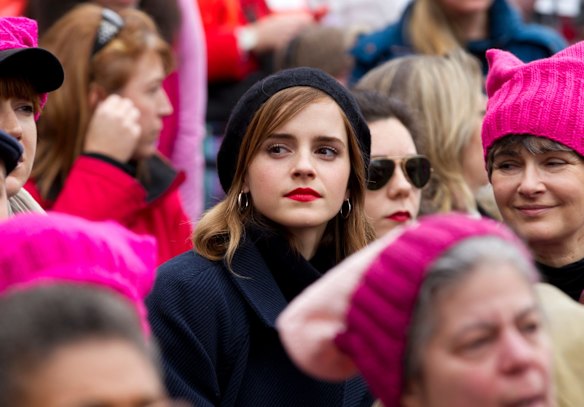 Actress Emma Watson sit with the crowd during the Women's March on Washington.