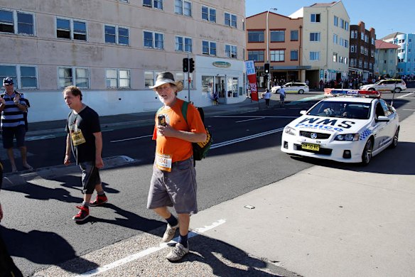 City 2 Surf 2013: The last two walkers heading down Bondi Road 500m from the finish.