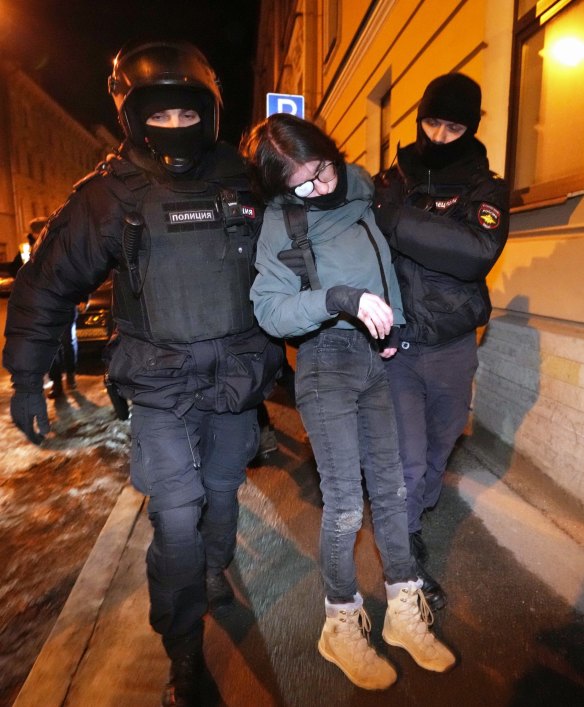 Policemen carry a young demonstrator who lost consciousness while being detained at an action against Russia’s attack on Ukraine in St. Petersburg, Russia.
