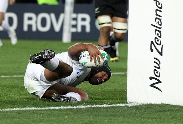 France's Thierry Dusautoir scores a try.
