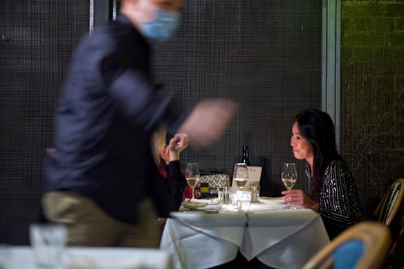 People enjoying the first hour of restaurants re-opening at the The Supper Club in Melbourne.