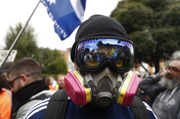 A protester is seen wearing protective gear to shield from capsicum spray by police on Burnley Street, Richmond in Melbourne.