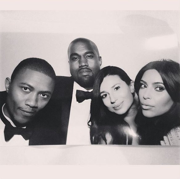 The newlyweds pose with West's hairdresser, Ibn Jasper.