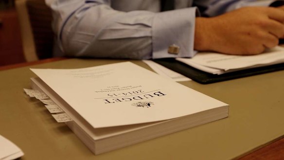 Treasurer Joe Treasurer poses with the Budget papers and his speech.