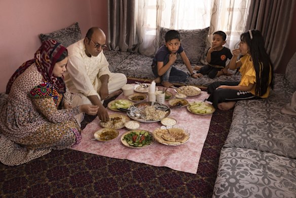 Special Immigrant Visa applicant Ajmal Sahak and his wife Halida eat lunch with their children Malwand, 9, Sabhanullah, 4, and Hella, 12, on the third day of Eid Al-Adha holiday on July 22, 2021 in Kabul, Afghanistan. Ajmal Sahak, who applied to the Afghan SIV, program is afraid that drivers won't get the same priority as translators. He was a driver for 10 years with a variety of American services. Thousands of Afghans who worked for the United States government during its nearly 20-year war here now fear for their safety as the US withdraws its troops from the country.