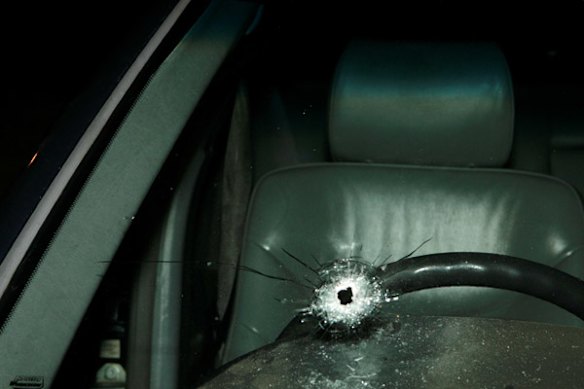 Bullet hole in Des Moran's car by a gunman charged from hiding in his front yard, March 17 2009.