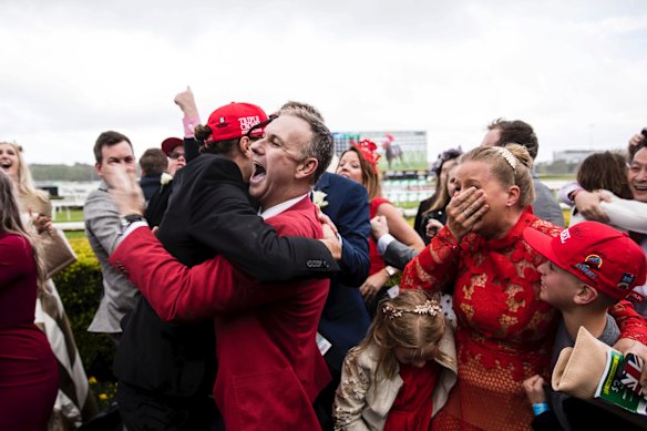 Punters celebrate Redzel winning the TAB Everest horse race held at Royal Randwick Racecourse.