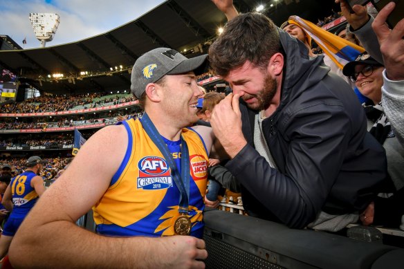 Brothers in arms: An emotional Mitch McGovern with brother Jeremy, after the latter was part of the Eagles’ 2018 premiership.