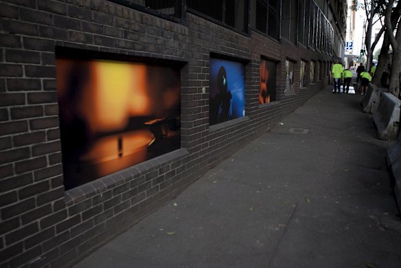 A group of Sydney based photographers have set up an impromptu photography exhibition along the walls of buildings on Elizabeth Street.